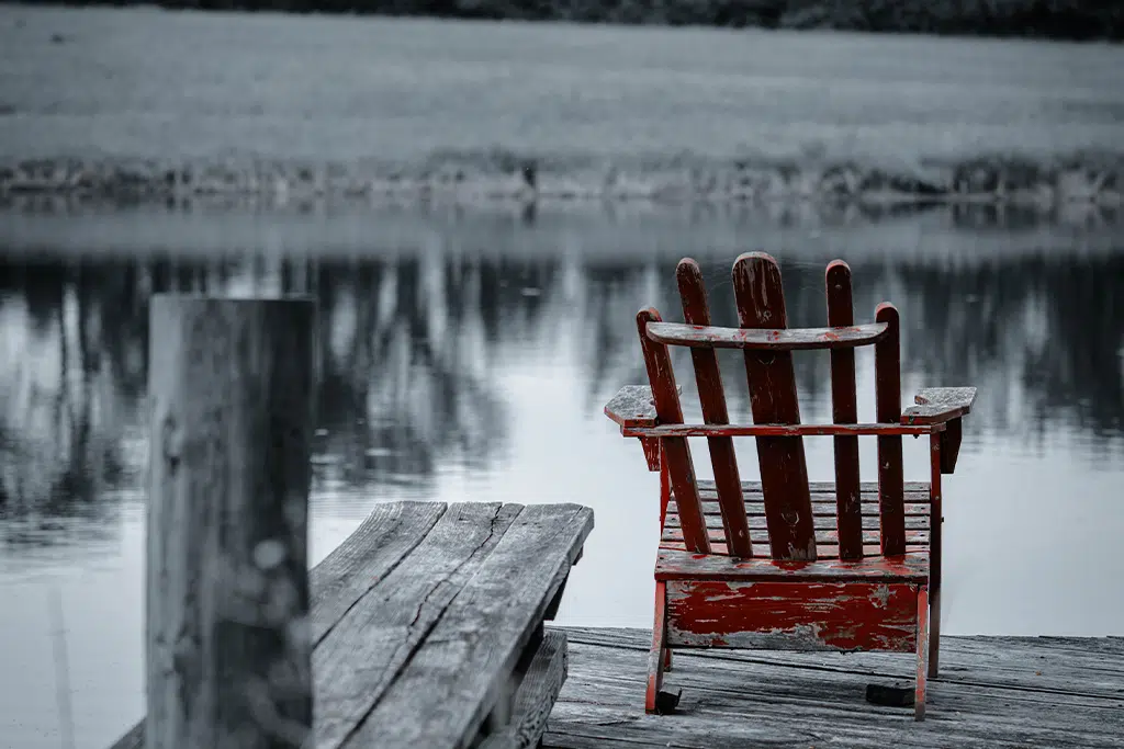 Rustic Chair Overlooking A Pond From A Build On Your Land Property