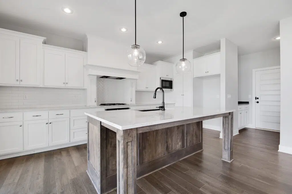 Lago Kitchen With Large Wood Island And White Cabinetry