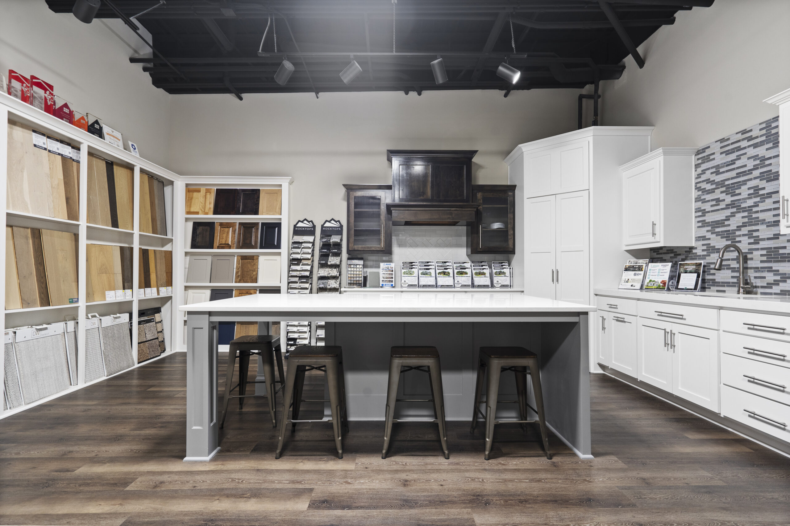Comerio Homes Design Center Kitchen Display With Cabinet, Flooring, And Countertop Selections