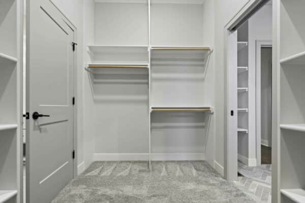 The Varese home design's spacious integrated closet and shelving space, with modern finishes.