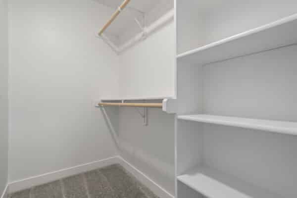 The Milano floor plan by Comerio Homes; showcasing the ample closet space and integrated storage shelving.