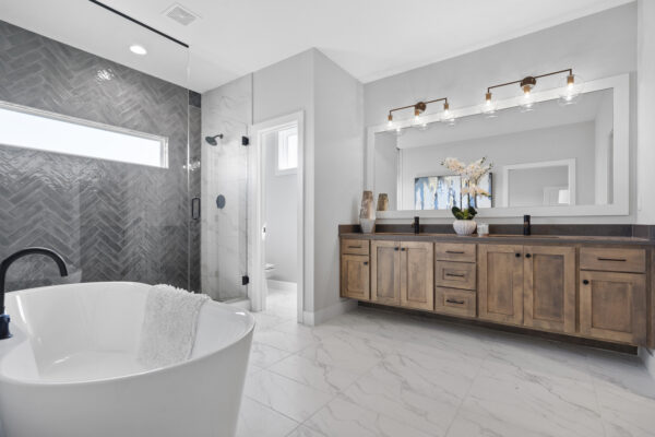 The Siena Story 1.5's master bathroom with free standing tub.