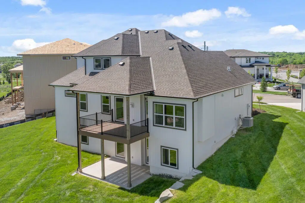 Angled Rear View Of The Comerio Homes Siena 1.5 With Upper Deck And Covered Patio.
