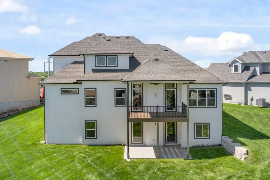 Comerio Homes Siena 1.5 Rear Exterior With Covered Patio And Upper Deck.