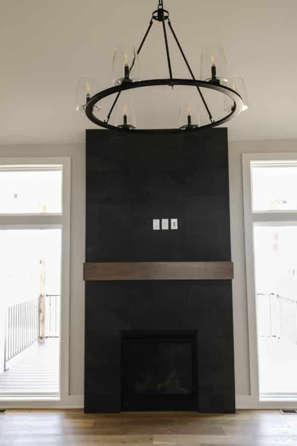 The Siena's focal fireplace, feauturing a modern dark finish, matching the central chandelier.
