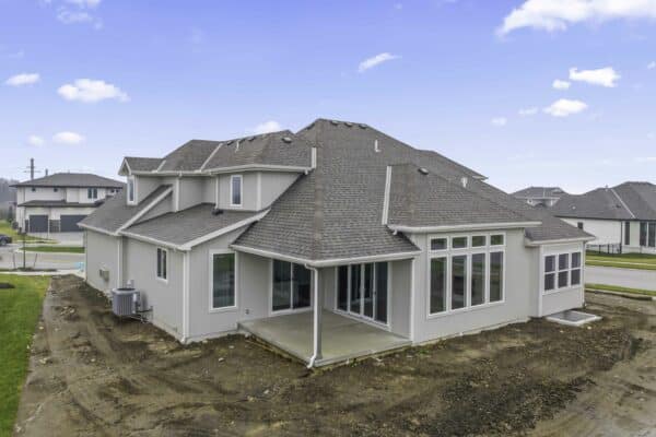 Exterior view of a nearly-completed Varese home design in Coventry Valley, Overland Park.