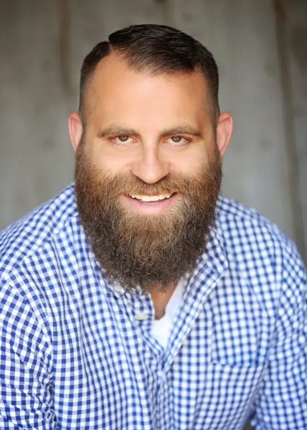 Professional headshot of Damon Comerio, founder of Comerio Homes.