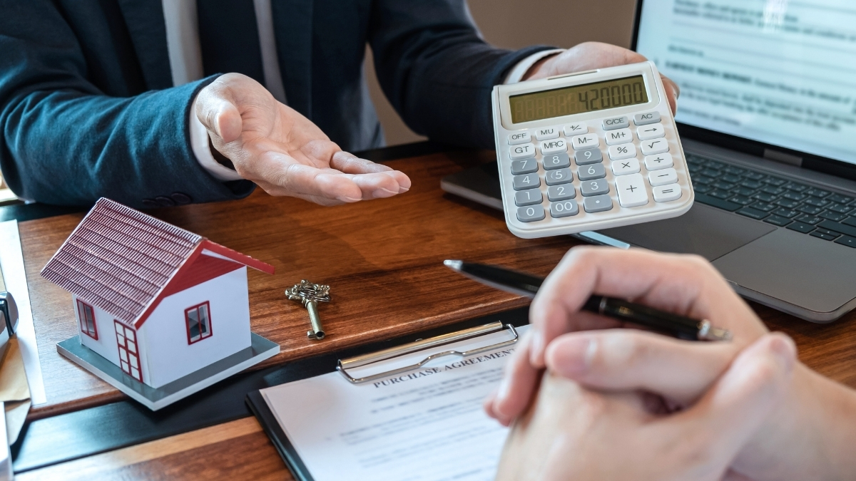 Reviewing pricing and cost details with a custom home builder at Comerio Homes