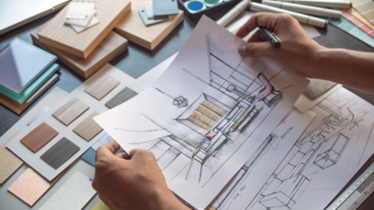 Reviewing Blueprints During Custom Home Planning With Comerio Homes