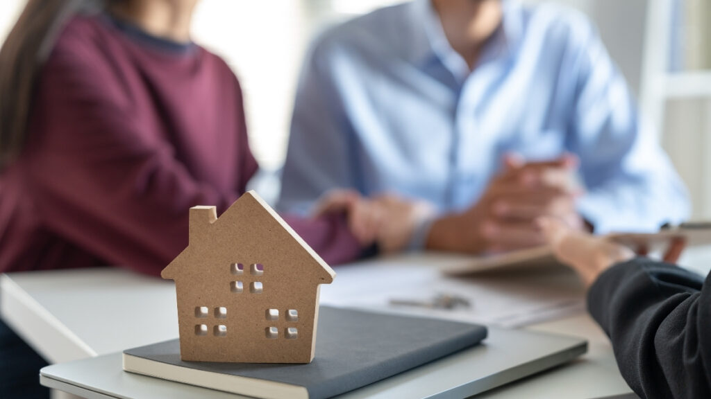Reviewing home design plans with a builder during the new construction process