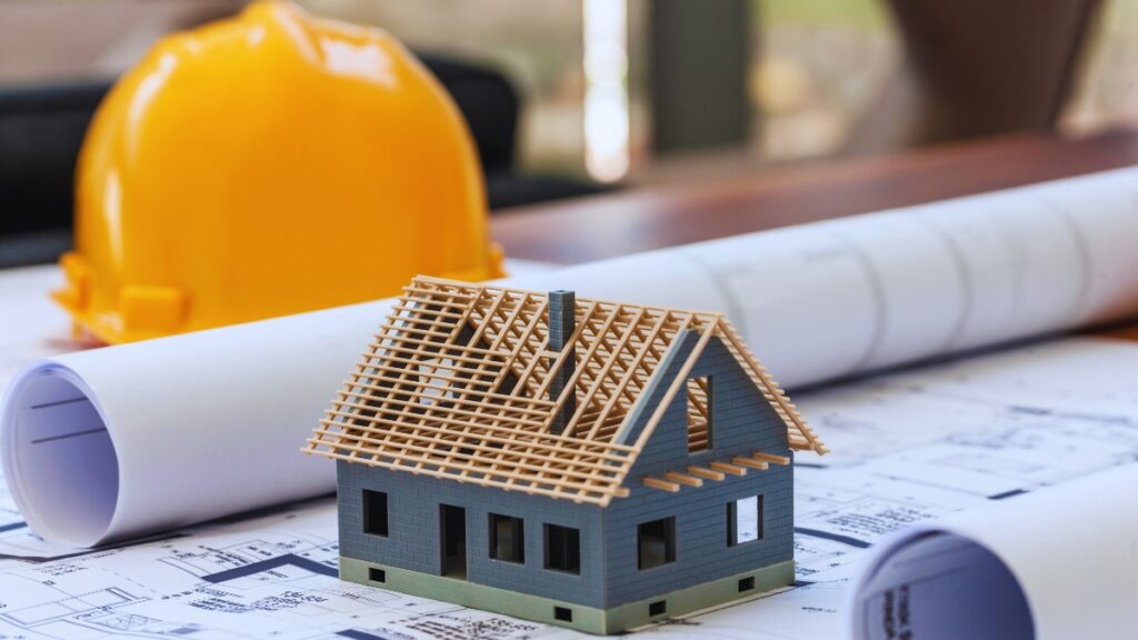 Homesite planning with blueprints and construction preparation for a new home build