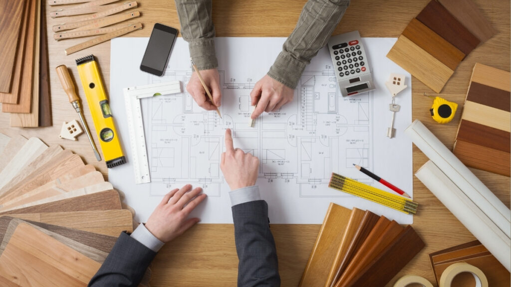 Reviewing construction plans and details during the home building process with Comerio Homes