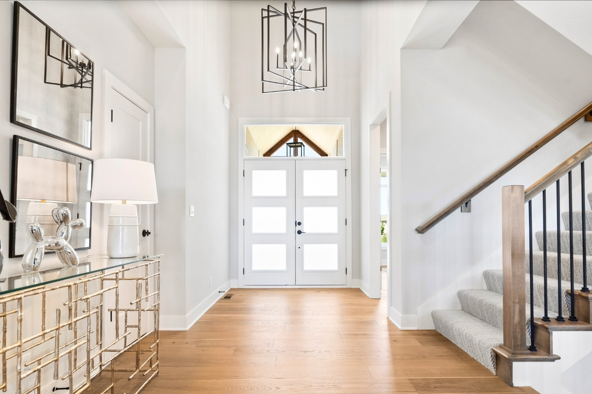 Entryway And Staircase Inside A Home Built By Johnson County Home Builders