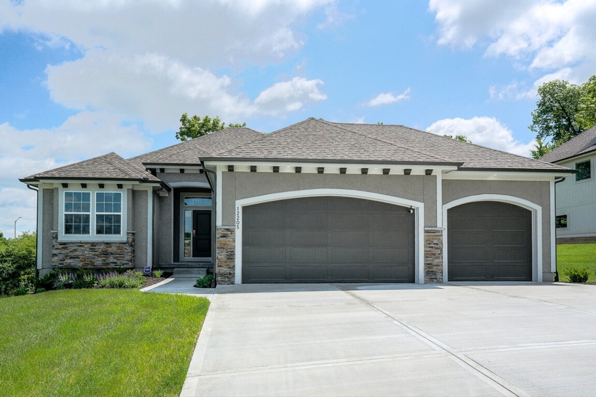 Reverse one and a half story home design in Kansas City floor plans