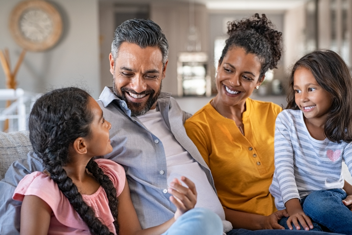 Family discussing a homebuilding decision with Olathe home builders