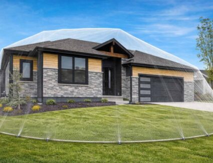 New Home Surrounded By Protective Net Representing Safety, Warranty, And Long-term Protection By Comerio Homes