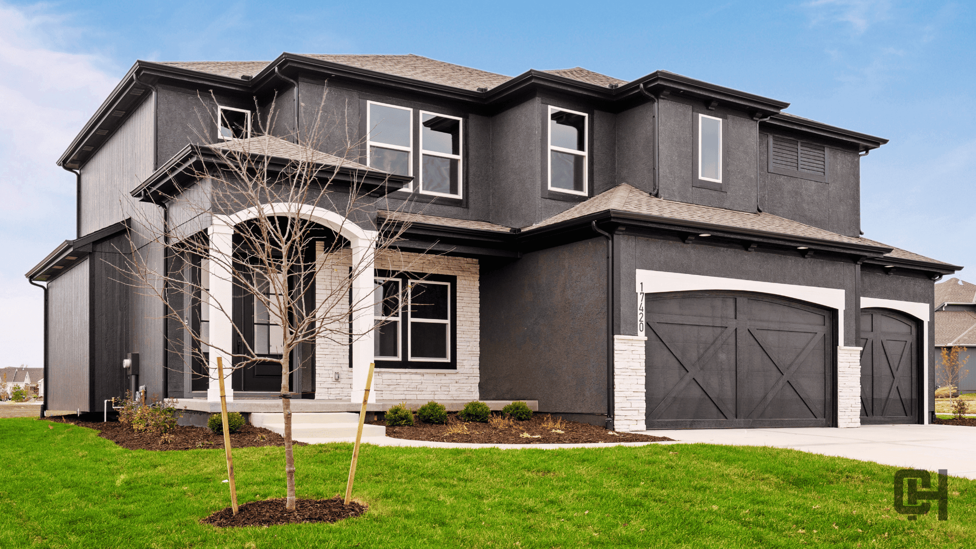 Comerio Homes Justina Elevation A Shown From An Angled Front Exterior View.